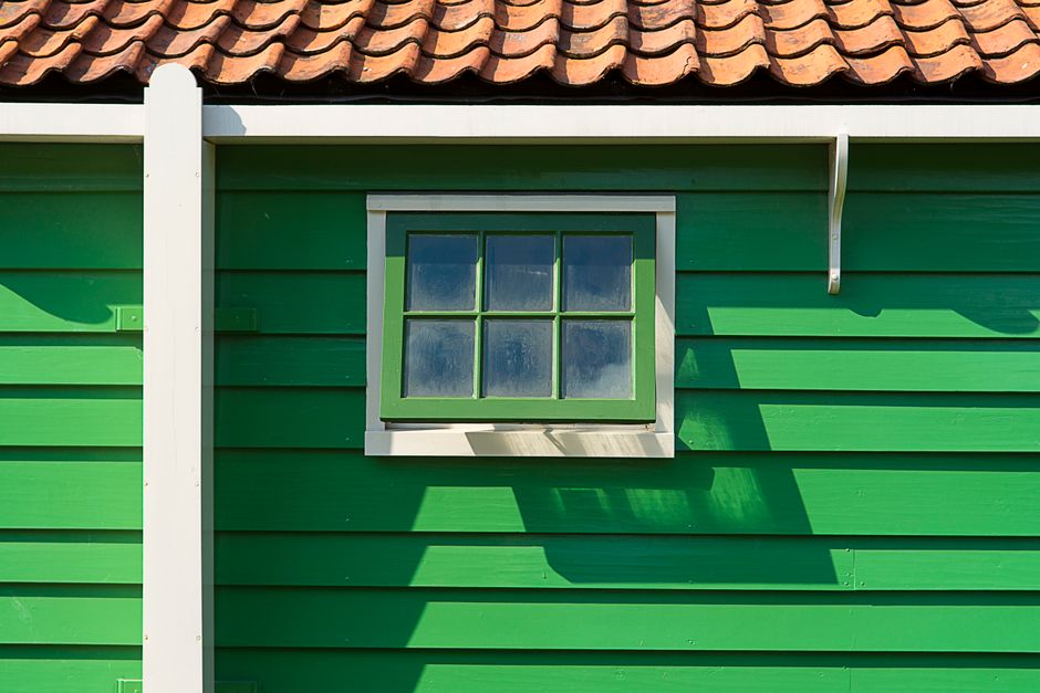 A house exterior with painted walls and trim.