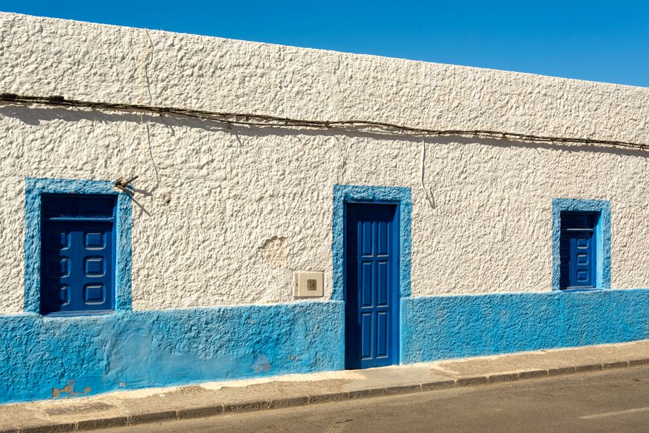 A house exterior with painted walls and trim.